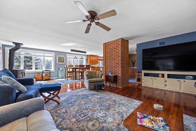 374 Youngs Ridge Rd, Acton, ME 04001 - living room featuring a wood stove, wood finished floors, and ceiling fan