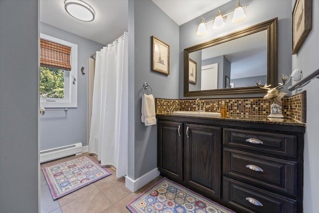 374 Youngs Ridge Rd, Acton, ME 04001 - bathroom featuring baseboard heating, decorative backsplash, tile patterned floors, vanity, and baseboards