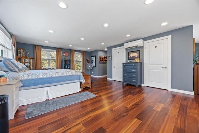 374 Youngs Ridge Rd, Acton, ME 04001 - bedroom with an AC wall unit, baseboards, wood finished floors, and recessed lighting