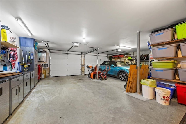 374 Youngs Ridge Rd, Acton, ME 04001 - garage featuring a garage door opener
