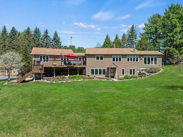 374 Youngs Ridge Rd, Acton, ME 04001 - back of house with a wooden deck, stairs, and a lawn
