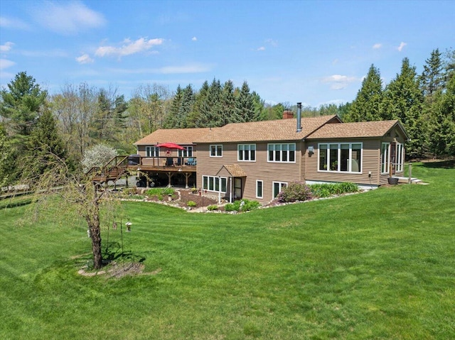374 Youngs Ridge Rd, Acton, ME 04001 - back of property featuring a deck, a chimney, and a lawn