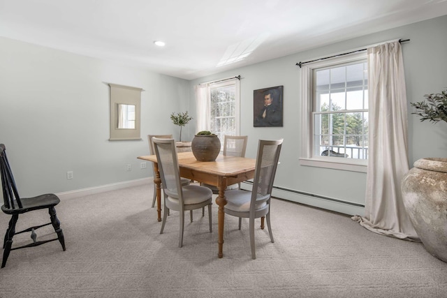 72 Natures Way, Wells, ME 04090 - dining space with healthy amount of natural light, carpet flooring, baseboard heating, and baseboards