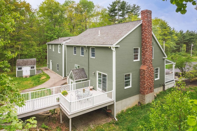 72 Natures Way, Wells, ME 04090 - rear view of house with a chimney, a wooden deck, and a shingled roof