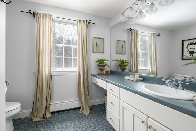 72 Natures Way, Wells, ME 04090 - bathroom with toilet, vanity, and baseboards