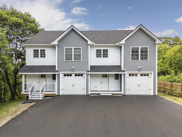 15 Androscoggin St Unit 1, Windham, ME 04062 - view of front of house with driveway, roof with shingles, covered porch, and an attached garage