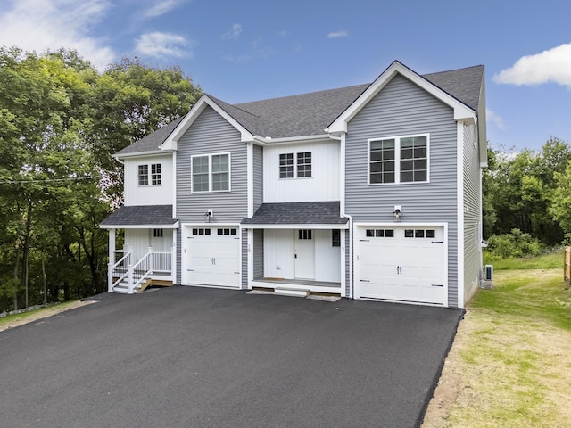 15 Androscoggin St Unit 1, Windham, ME 04062 - view of front facade featuring roof with shingles, driveway, and board and batten siding