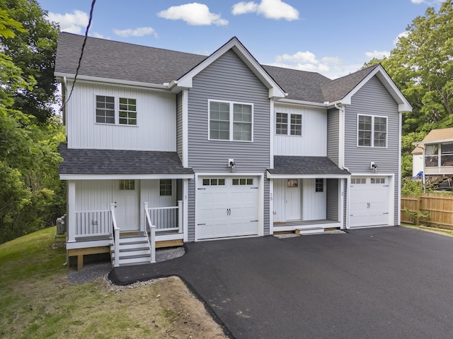 15 Androscoggin St Unit 1, Windham, ME 04062 - view of front of home featuring covered porch, a shingled roof, driveway, and an attached garage