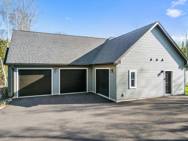 view of home's exterior featuring roof with shingles