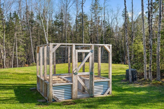 view of outdoor structure featuring a view of trees
