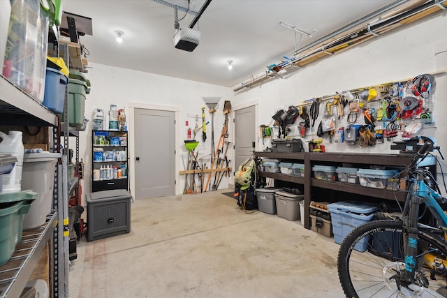 garage featuring a garage door opener and a workshop area