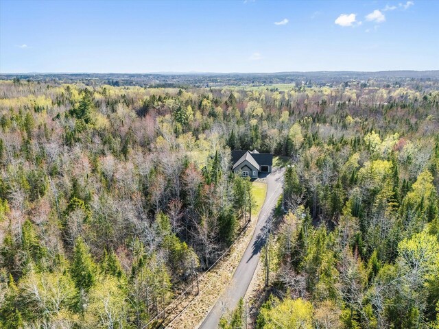 view from above of property featuring a forest