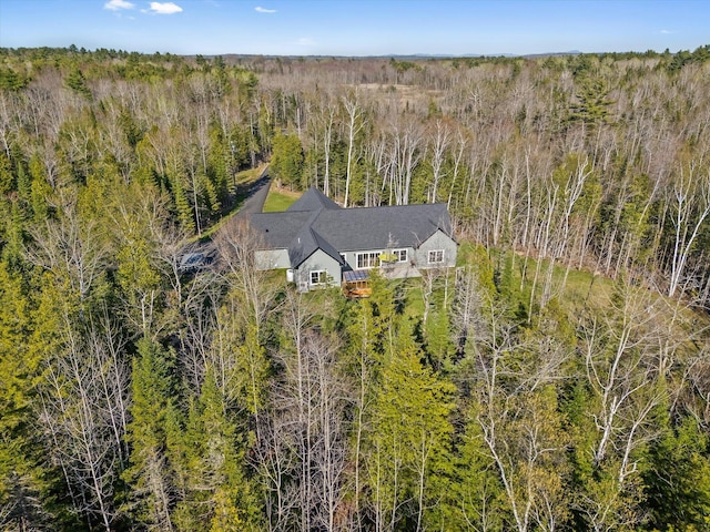 view from above of property with a heavily wooded area
