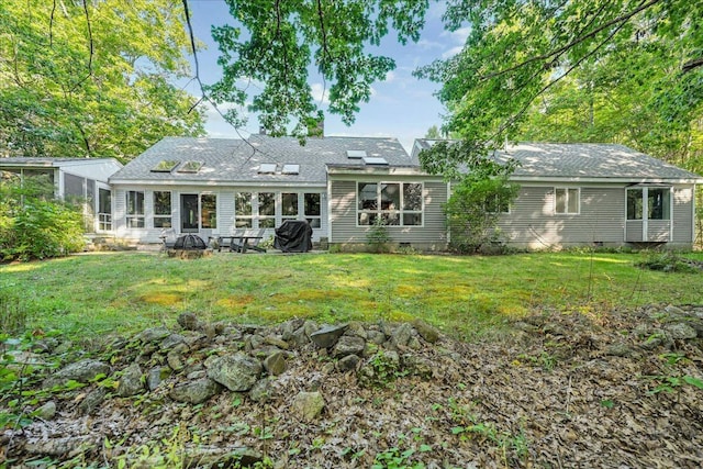 29 Penny Ln, Blue Hill, ME 04614 - rear view of house featuring a sunroom, crawl space, roof with shingles, and a lawn
