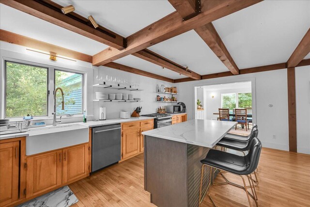 29 Penny Ln, Blue Hill, ME 04614 - kitchen featuring plenty of natural light, a kitchen bar, stainless steel appliances, a sink, and open shelves