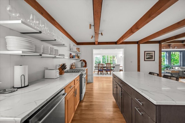 29 Penny Ln, Blue Hill, ME 04614 - kitchen with open shelves, stainless steel appliances, beam ceiling, a wealth of natural light, and light wood-style flooring