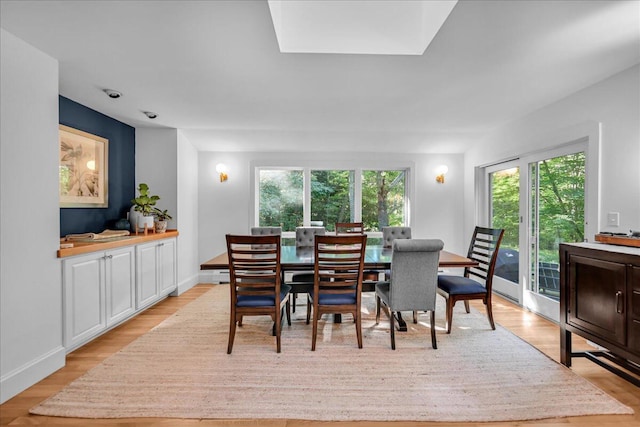 29 Penny Ln, Blue Hill, ME 04614 - dining room with baseboards, light wood finished floors, and a wealth of natural light