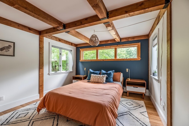29 Penny Ln, Blue Hill, ME 04614 - bedroom with baseboards, light wood-type flooring, and beam ceiling
