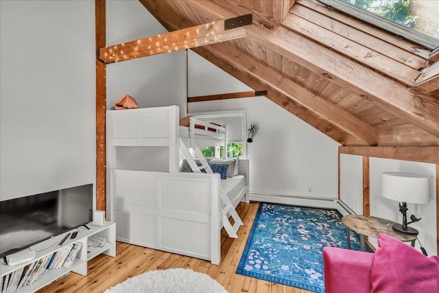 29 Penny Ln, Blue Hill, ME 04614 - bedroom featuring vaulted ceiling with beams, a baseboard radiator, and wood finished floors