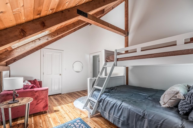 29 Penny Ln, Blue Hill, ME 04614 - bedroom with high vaulted ceiling, beamed ceiling, and hardwood / wood-style flooring