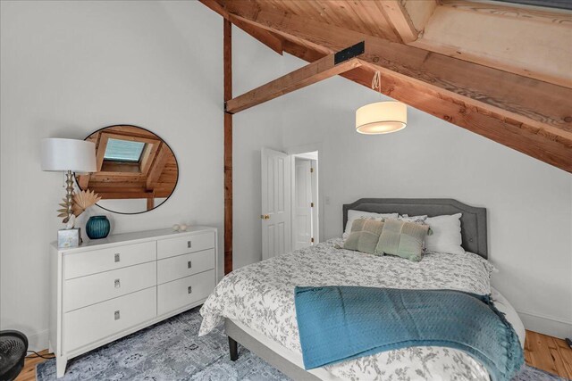 29 Penny Ln, Blue Hill, ME 04614 - bedroom featuring high vaulted ceiling, wood finished floors, and beamed ceiling