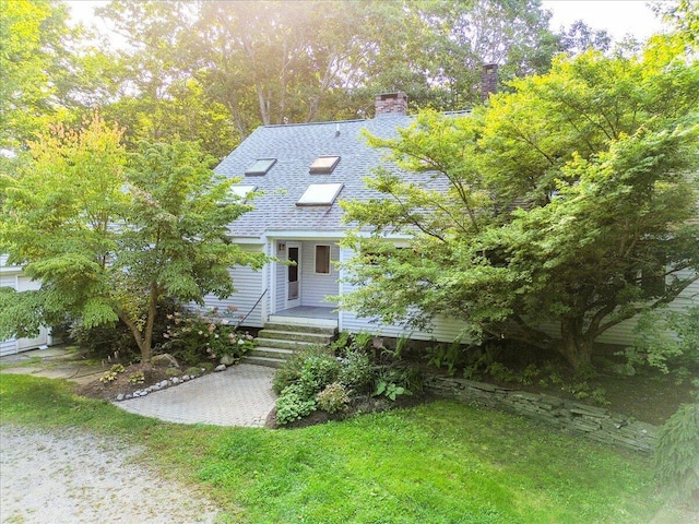 29 Penny Ln, Blue Hill, ME 04614 - view of front of property with a porch, roof with shingles, and a chimney