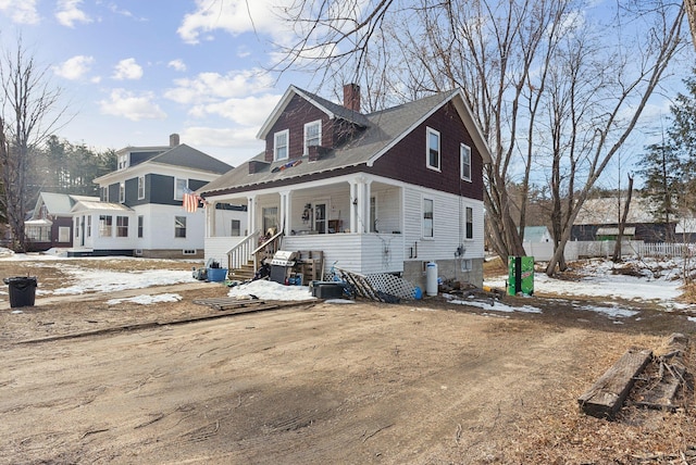 107 Portland St, Fryeburg, ME 04037 - view of front of house featuring a chimney and covered porch