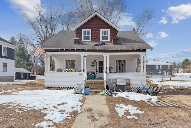 107 Portland St, Fryeburg, ME 04037 - bungalow-style home with a shingled roof and covered porch