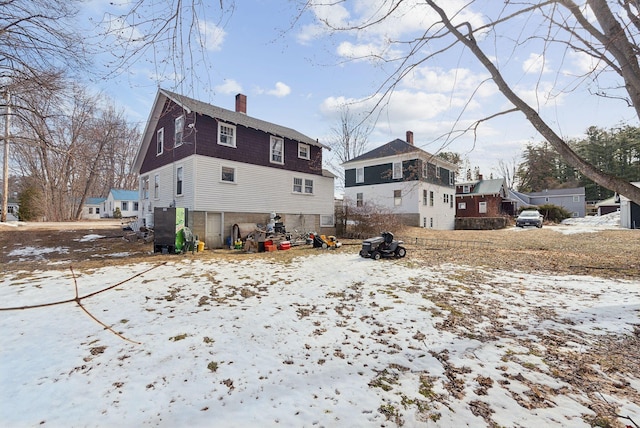 107 Portland St, Fryeburg, ME 04037 - snow covered property with a chimney