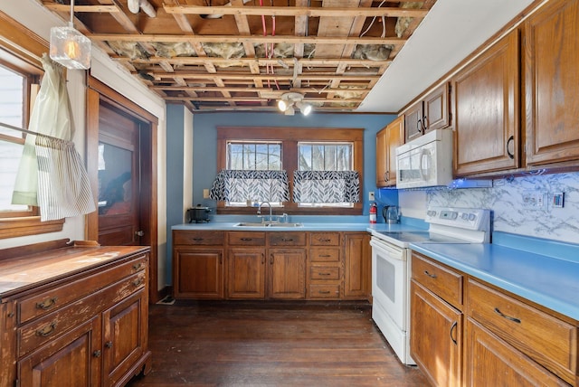 107 Portland St, Fryeburg, ME 04037 - kitchen featuring white appliances, brown cabinets, a sink, dark wood-style floors, and backsplash