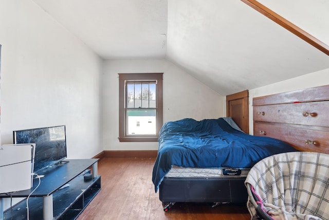 107 Portland St, Fryeburg, ME 04037 - bedroom featuring baseboards, lofted ceiling, and wood finished floors