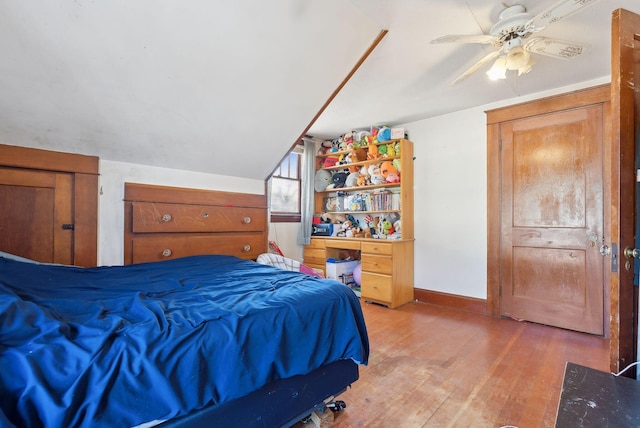 107 Portland St, Fryeburg, ME 04037 - bedroom featuring baseboards, vaulted ceiling, light wood-style flooring, and ceiling fan