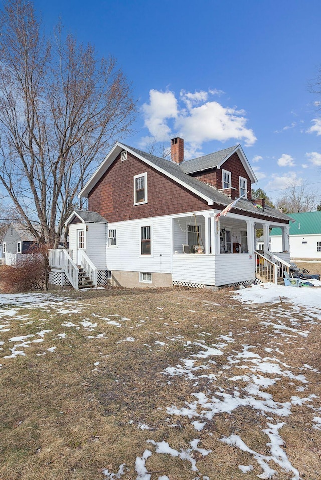 107 Portland St, Fryeburg, ME 04037 - snow covered rear of property with a chimney