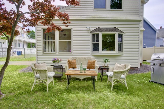 28 Saco Ave, Old Orchard Beach, ME 04064 - back of house featuring fence and a lawn