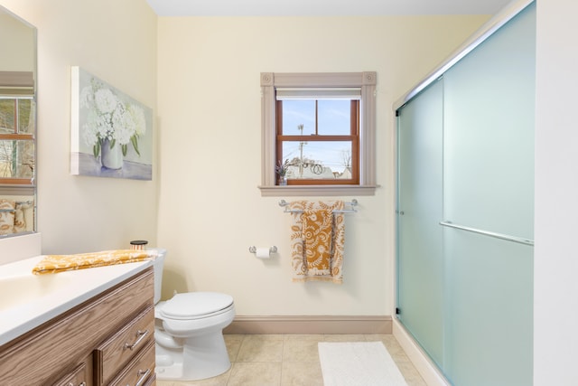 28 Saco Ave, Old Orchard Beach, ME 04064 - bathroom featuring baseboards, toilet, an enclosed shower, vanity, and tile patterned flooring