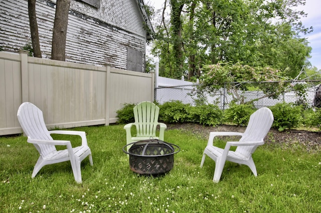 28 Saco Ave, Old Orchard Beach, ME 04064 - view of yard featuring a fenced backyard and a fire pit