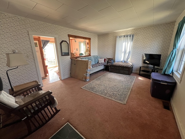 38 Access Hwy, Limestone, ME 04750 - living area with carpet flooring and wallpapered walls