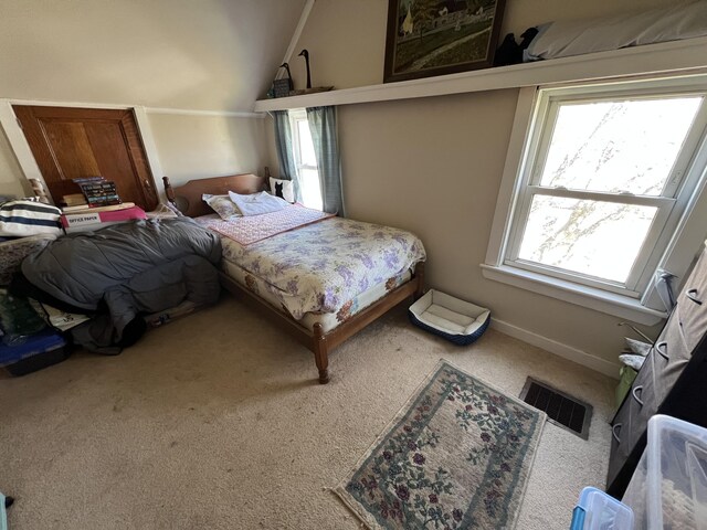 38 Access Hwy, Limestone, ME 04750 - bedroom featuring visible vents, carpet flooring, lofted ceiling, and multiple windows