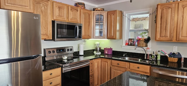 612 Franklin St, Rumford, ME 04276 - kitchen featuring stainless steel appliances, a sink, dark stone counters, glass insert cabinets, and ornamental molding