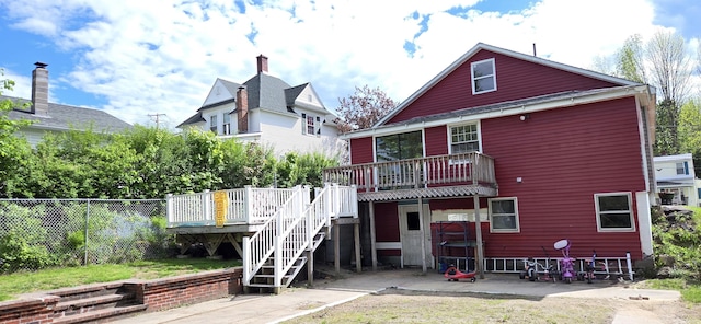 612 Franklin St, Rumford, ME 04276 - back of property featuring stairway and a wooden deck