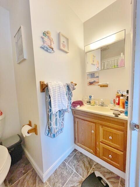 160 Washington Ave, Portland, ME 04101 - bathroom with vanity, toilet, and baseboards