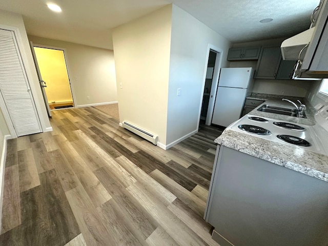 160 Washington Ave, Portland, ME 04101 - kitchen featuring a baseboard heating unit, white appliances, a sink, gray cabinetry, and baseboards
