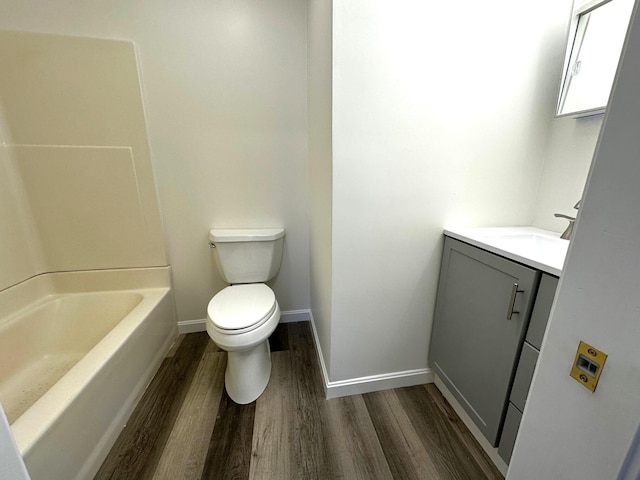 160 Washington Ave, Portland, ME 04101 - bathroom featuring wood finished floors, vanity, toilet, and baseboards