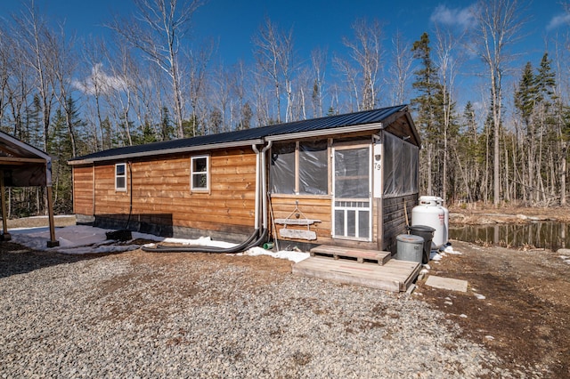 79 Young Ln, Burnham, ME 04922 - view of front of house featuring metal roof