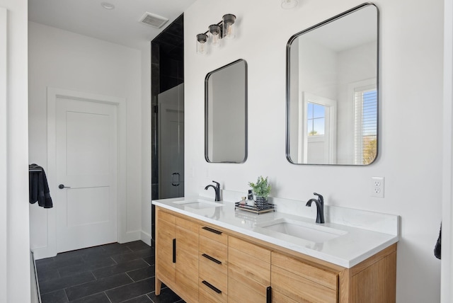 68 Green Acres Dr, Buxton, ME 04093 - full bath with tile patterned floors, double vanity, a sink, and visible vents