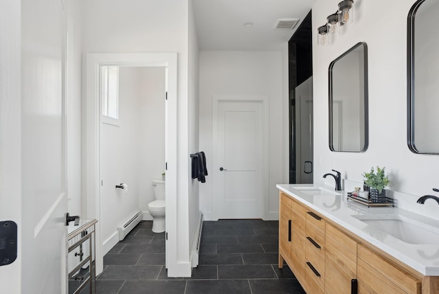 68 Green Acres Dr, Buxton, ME 04093 - bathroom featuring toilet, a baseboard radiator, a sink, and visible vents