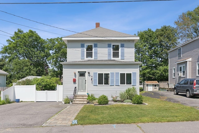 53 Ocean View Ave, South Portland, ME 04106 - traditional style home with a chimney, asphalt driveway, and an outdoor structure