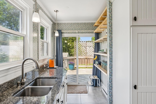 53 Ocean View Ave, South Portland, ME 04106 - kitchen with light tile patterned flooring, pendant lighting, dark stone counters, and open shelves