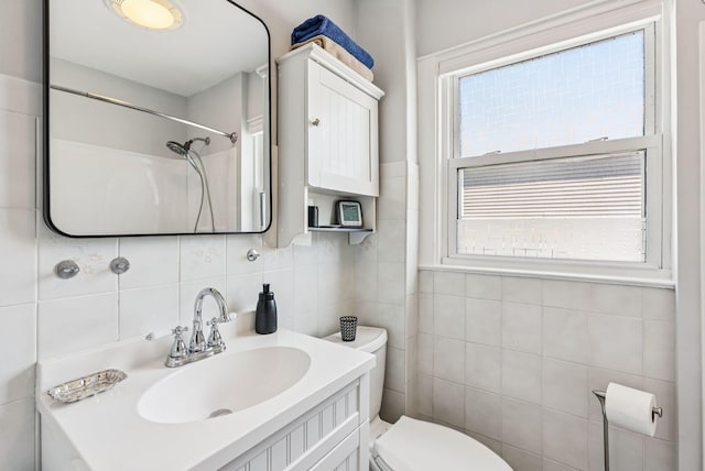 53 Ocean View Ave, South Portland, ME 04106 - full bathroom featuring tile walls, vanity, and tasteful backsplash
