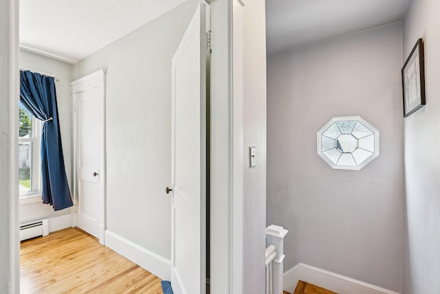 53 Ocean View Ave, South Portland, ME 04106 - hallway with an upstairs landing, light wood-type flooring, and a baseboard heating unit